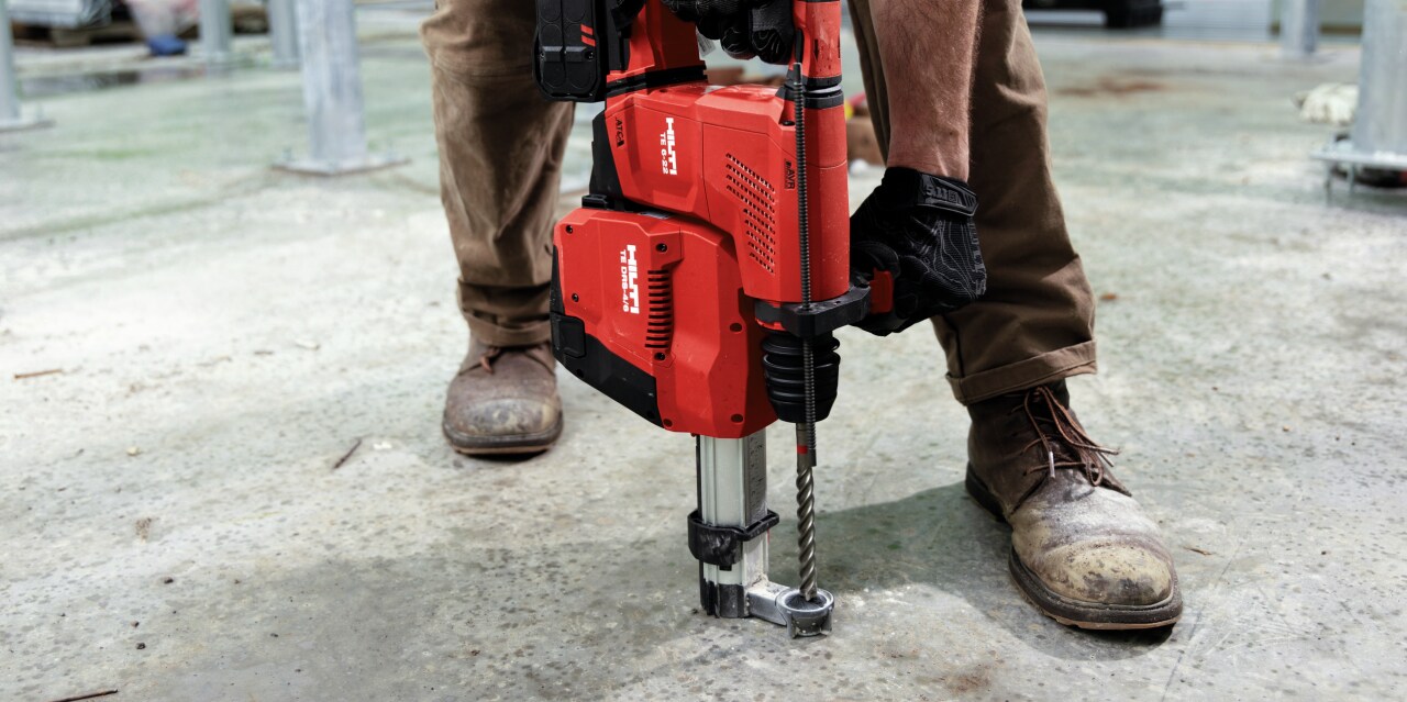 TE 6-A22 cordless rotary hammer being used with an integrated dust removal system